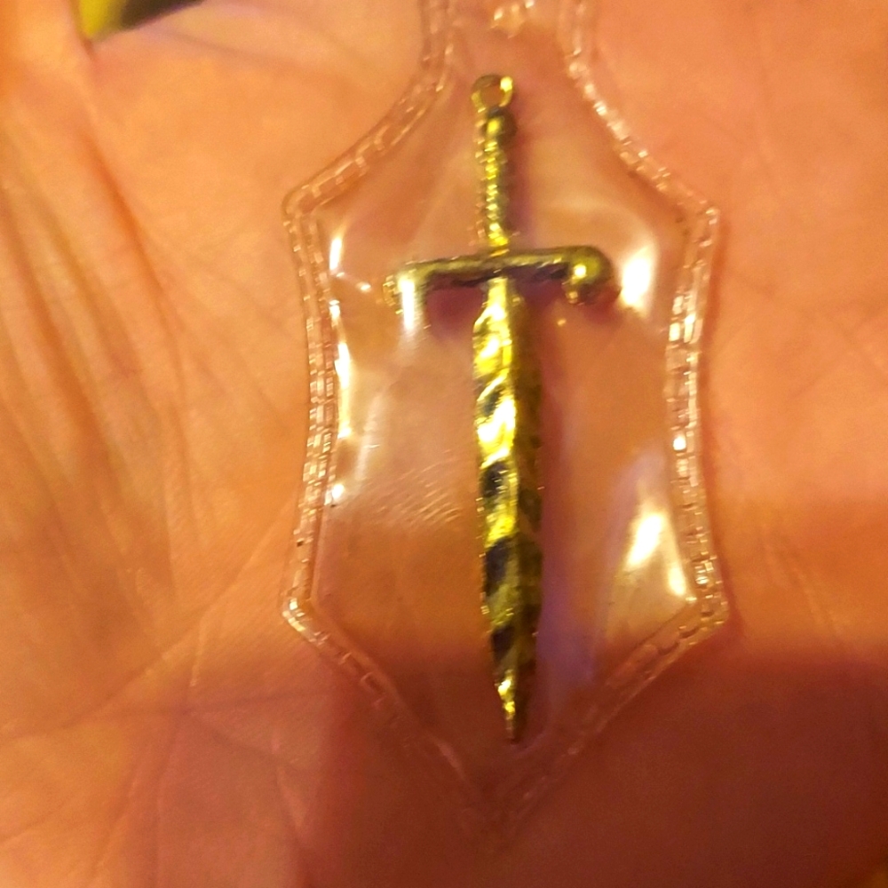 St. Michel engraved enclosed gold sword pendant